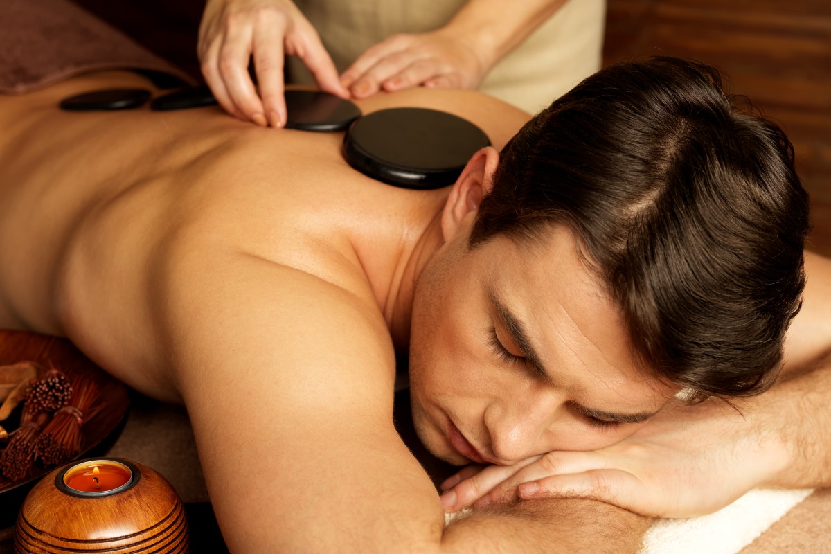 handsome-man-having-stone-massage-spa-salon-healthy-lifestyle (1)